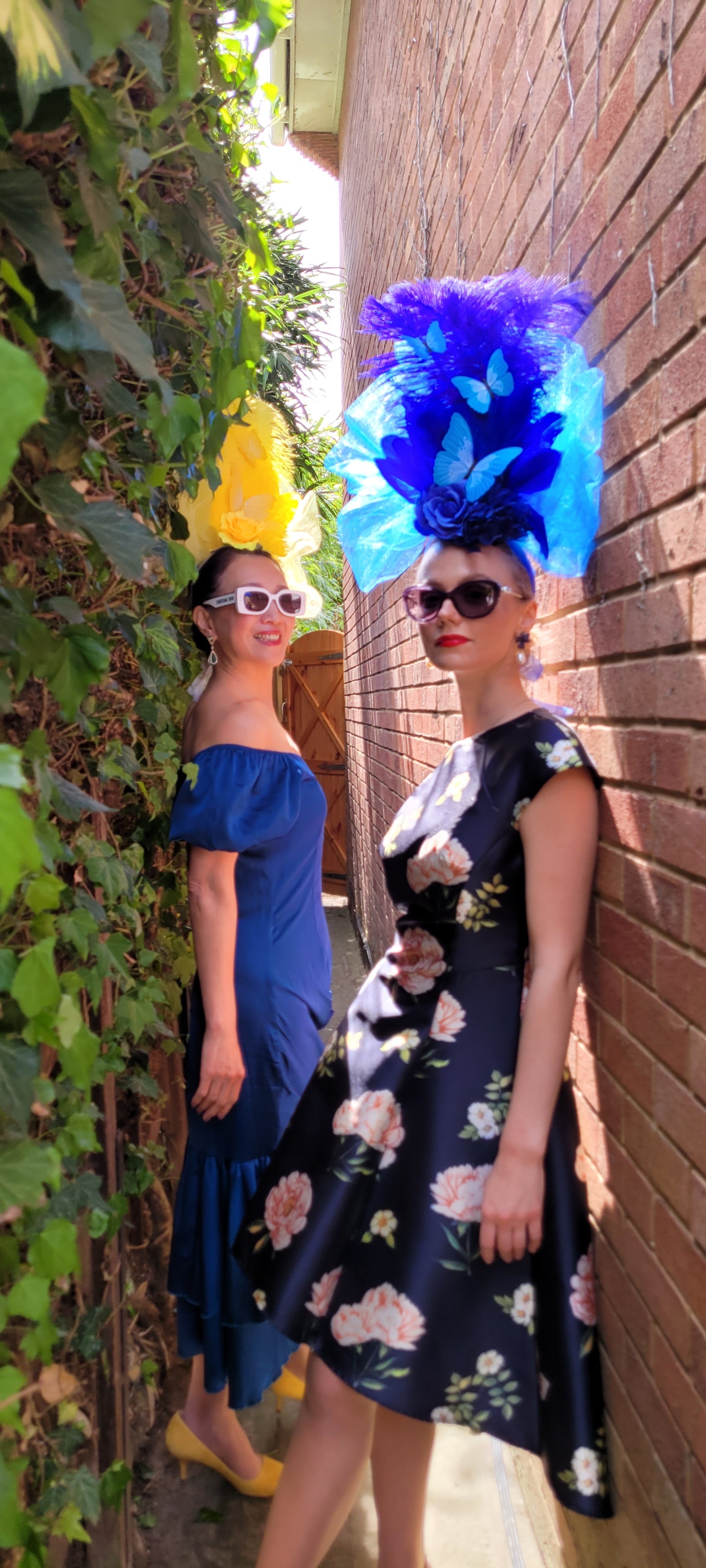 Extravagant Colorful Feather and Flower Headpiece with Butterfly Accents for Special Occasions